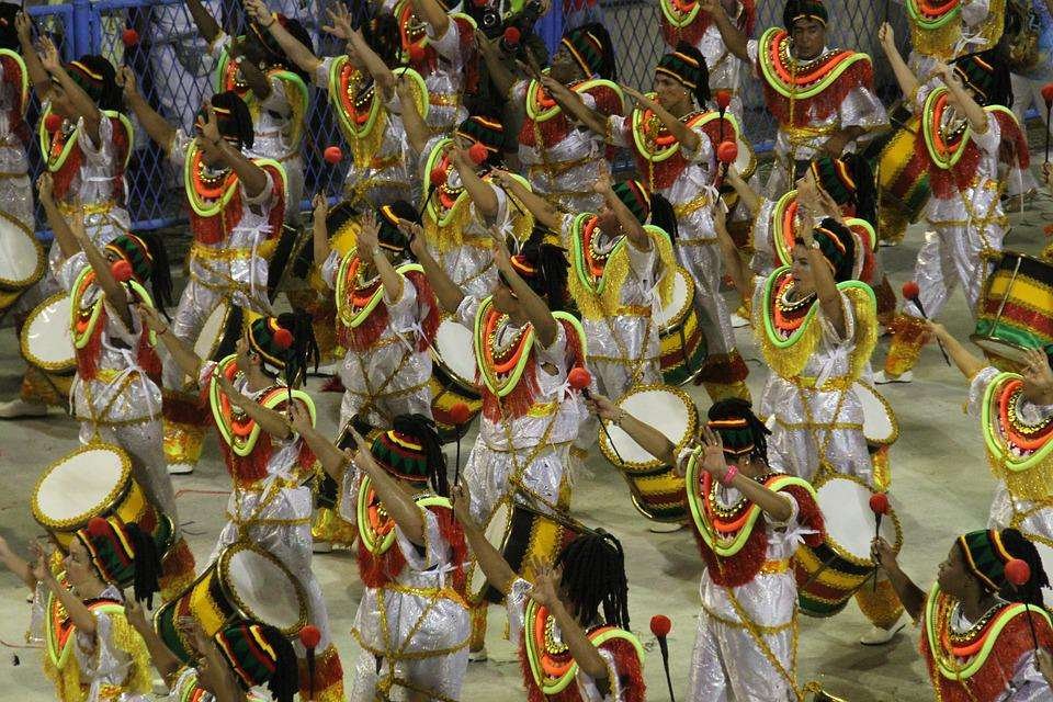 Group of women with cultural attires and drums dancing in Rio Carnival, Rio de Janeiro, Brazil