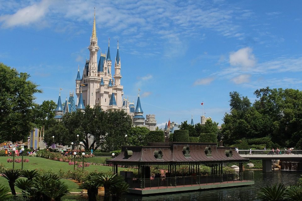 A daytime photo of Walt Disney World, Florida showing lots of well tamed trees, and castles