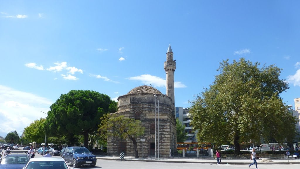 a old brown mosque under a blue sky in one of the recommended attractions in Vlore, Albania