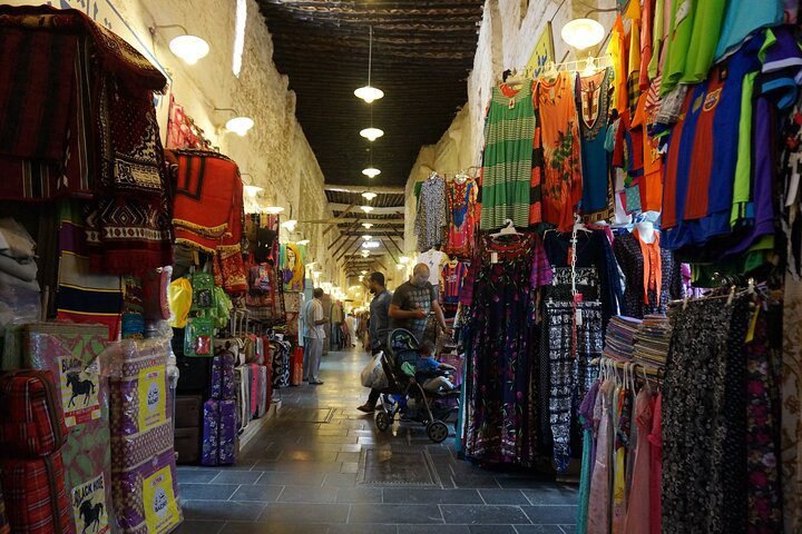 people walking in a market in tourist attractions in Al Wakrah, Qatar
