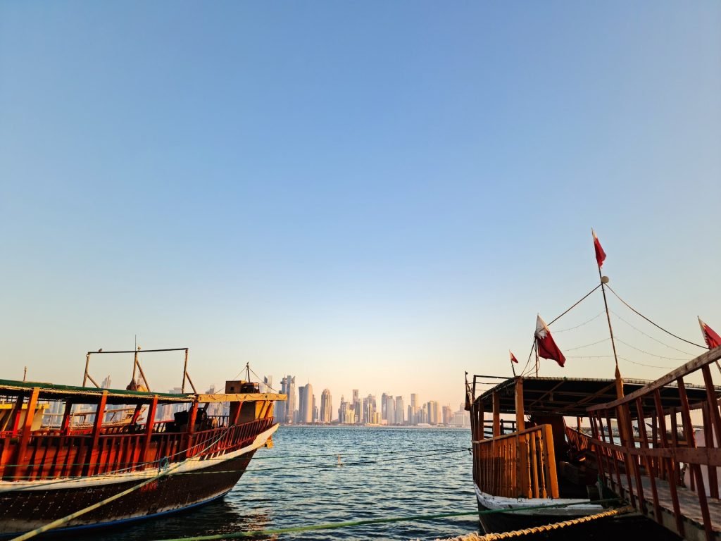 boats in an ocean during daytime in top places to have fun in Doha, Qatar