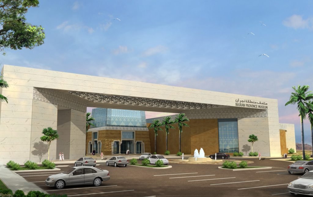 a white and yellow building under a blue sky in daytime in  places to visit in Najran, Saudi Arabia