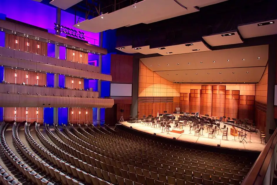 DeVos performance Hall showing many seats for audience and also musical instruments on the stage