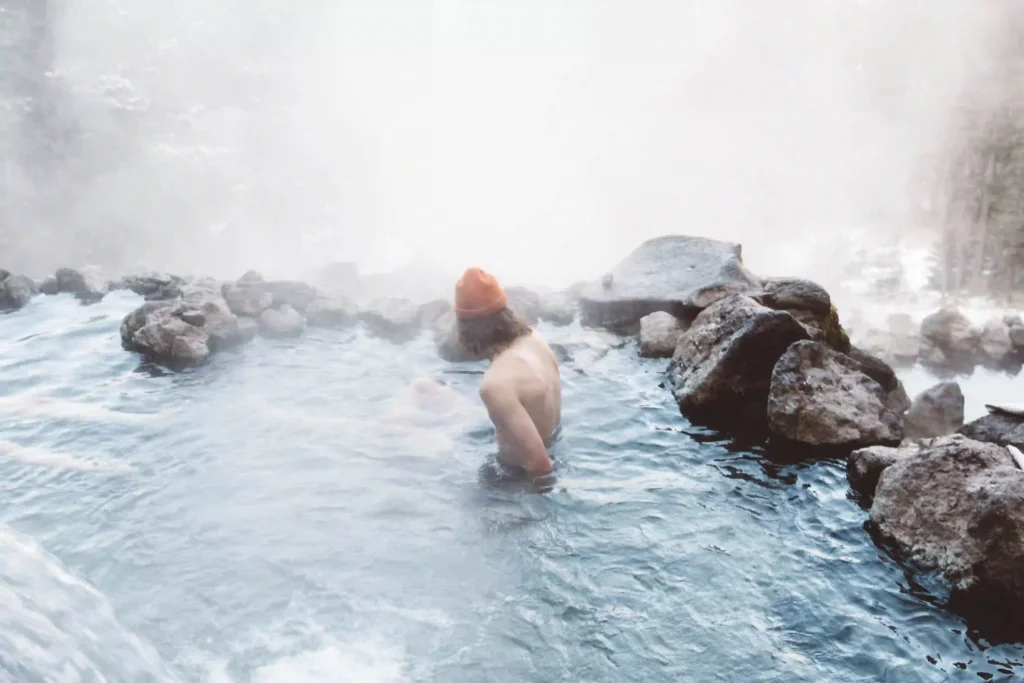 A man siting in a Hot Spring 