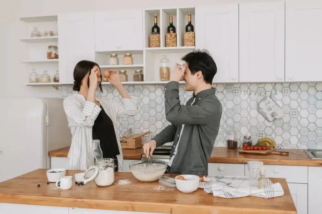 A couple cooking together. 