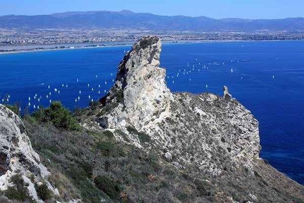 Sella del Diavolo– Cagliari mountain with birds flying and ships in the seaside