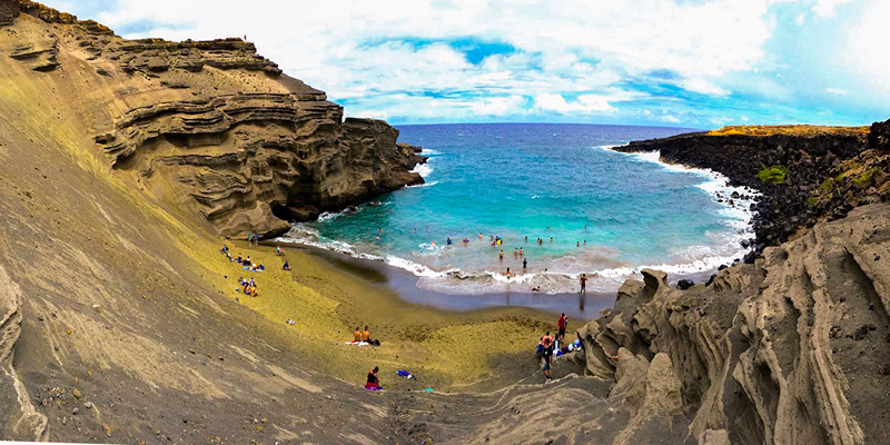 An image of Owenego Beach & Tennis Club with Tourists in the seashore