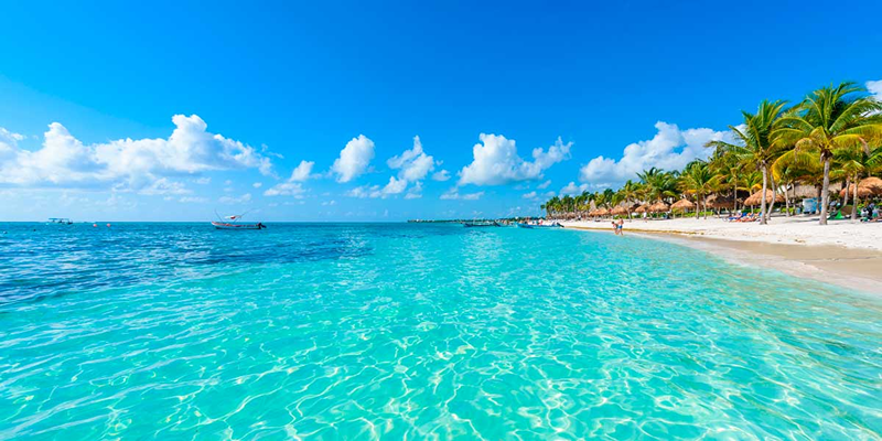 Stony Creek Beach with blue sky and crystal clear waters and tourists at the seashore