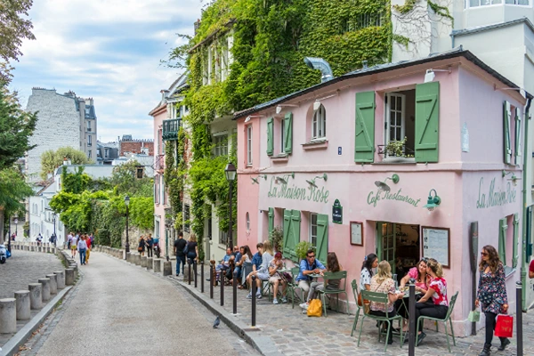 Article on romantic places to go for anniversary

A colourful street with people sitting and talking 