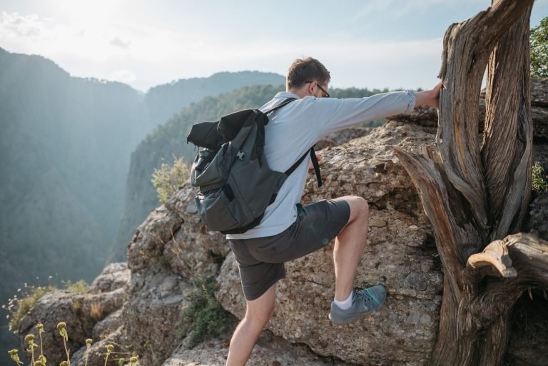 a man hiking on a mountain