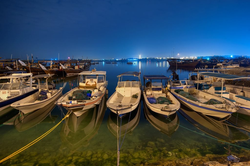 boats arranged on the sea at night